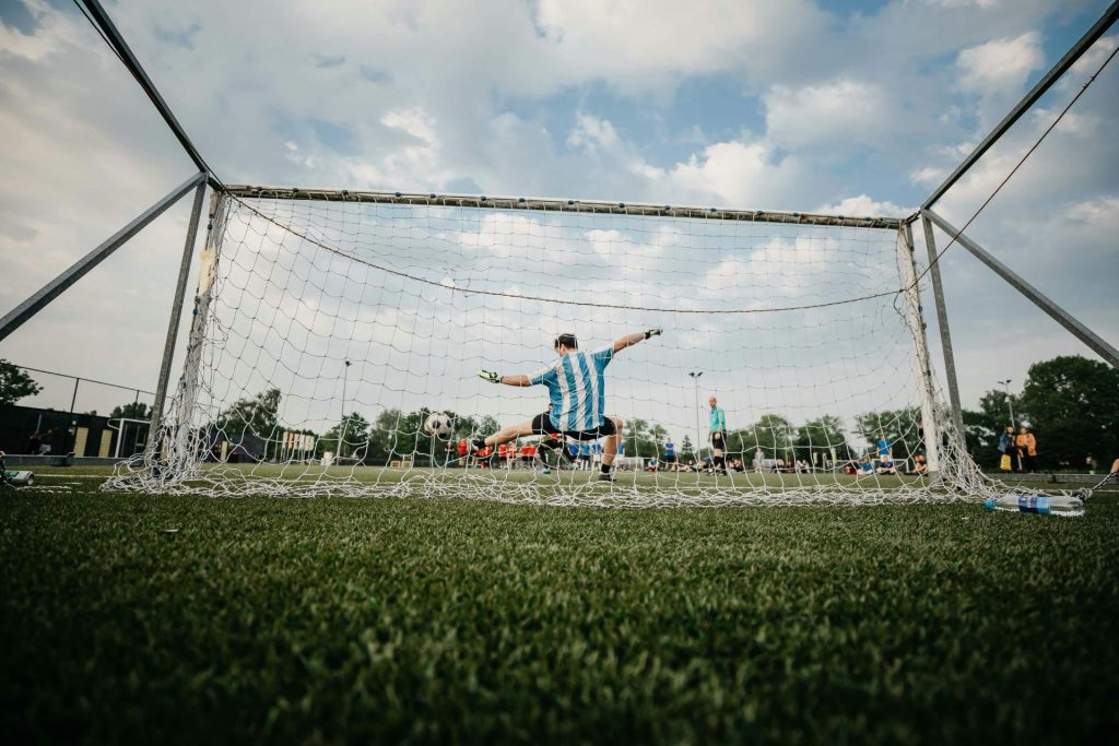 Goalkeeper making a save from goal view